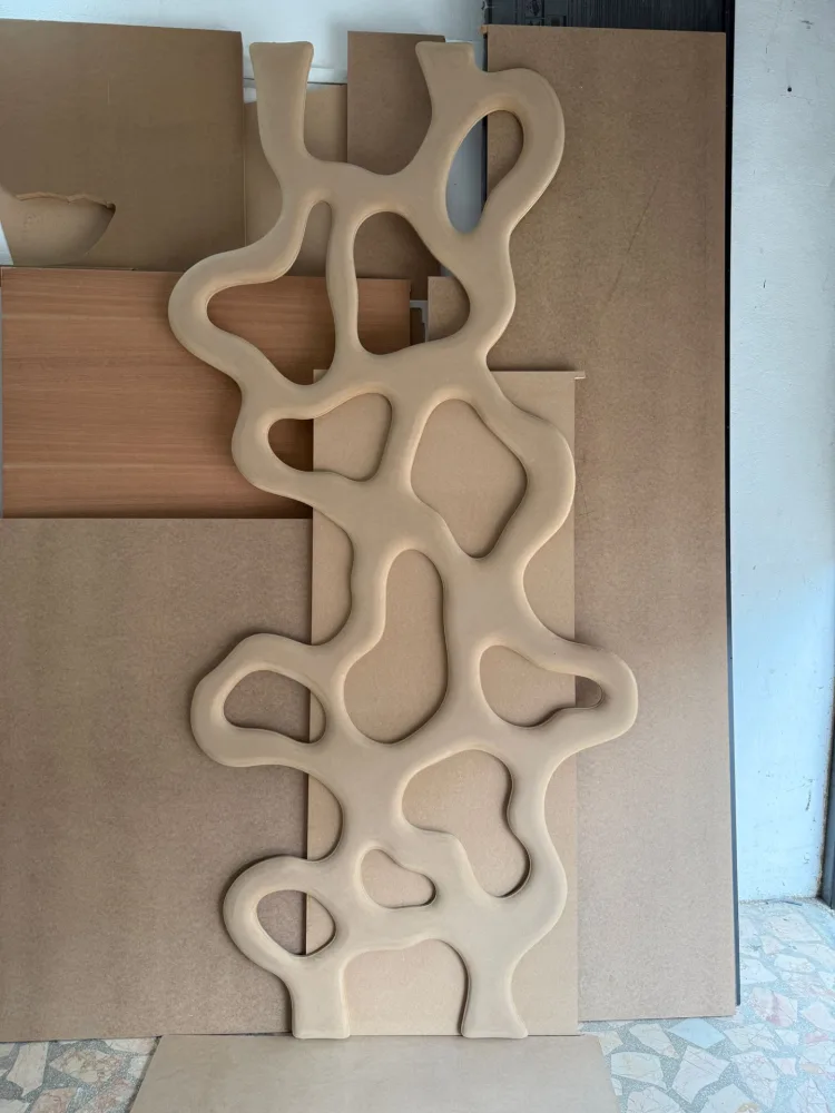 Decorative panel cut with interlocking line patterns