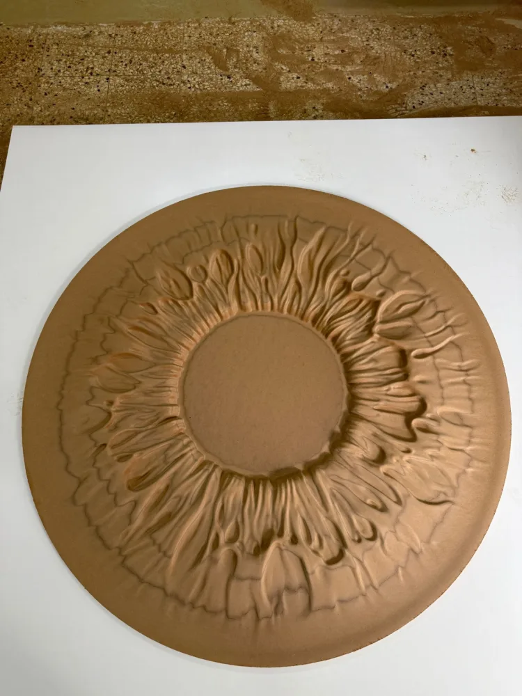 Circular relief mounted on a wall