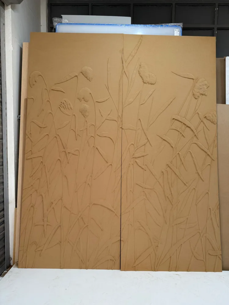 Unfinished panel machined with leaf outlines