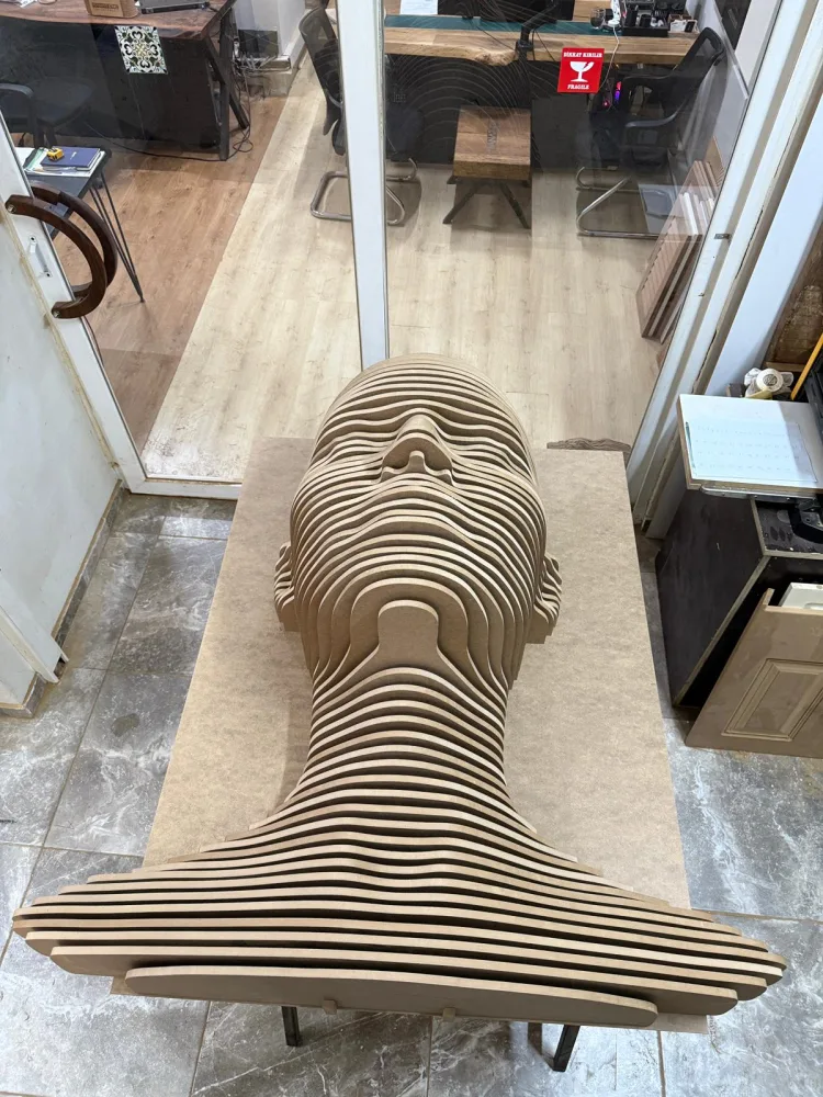 Relief carving of a layered human face